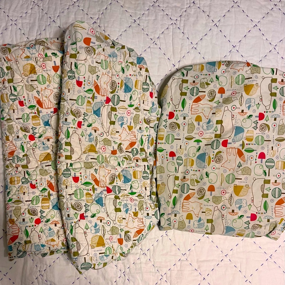Set of two Woodland themed changing pad covers & matching crib sheet.